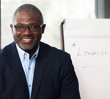 african american businessman giving presentation on leadership